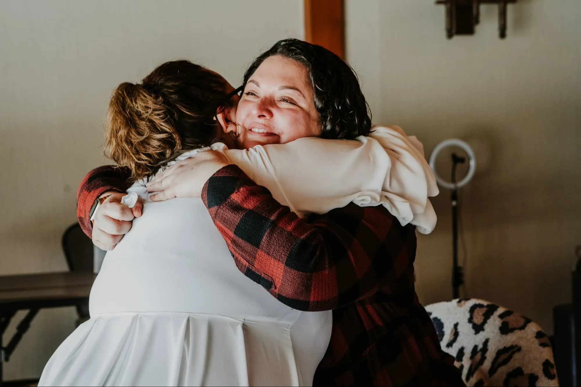 A warm hug between women at a gathering pictured on Carla's site